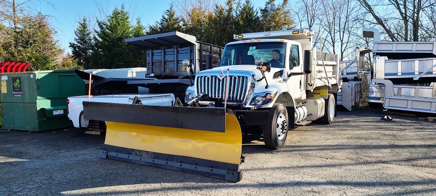 This International truck has a Galion/Godwin body, Force America hydraulics, Valk snowplow, and Swenson Salt Spreader.